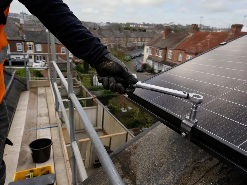 Panel clamps checked with a torque wrench during a solar service, Birmingham