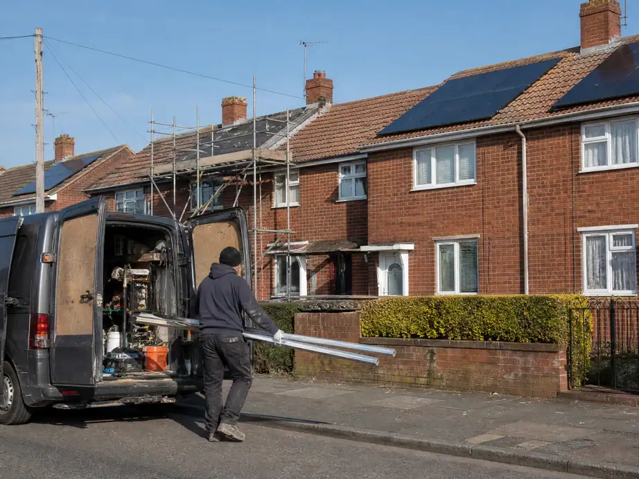 Post-war estate houses in Tamworth, some with solar panels and one being fitted