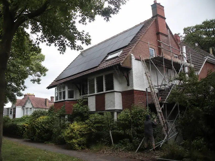 Solar panels on a detached house on a tree-lined road in Sutton Coldfield
