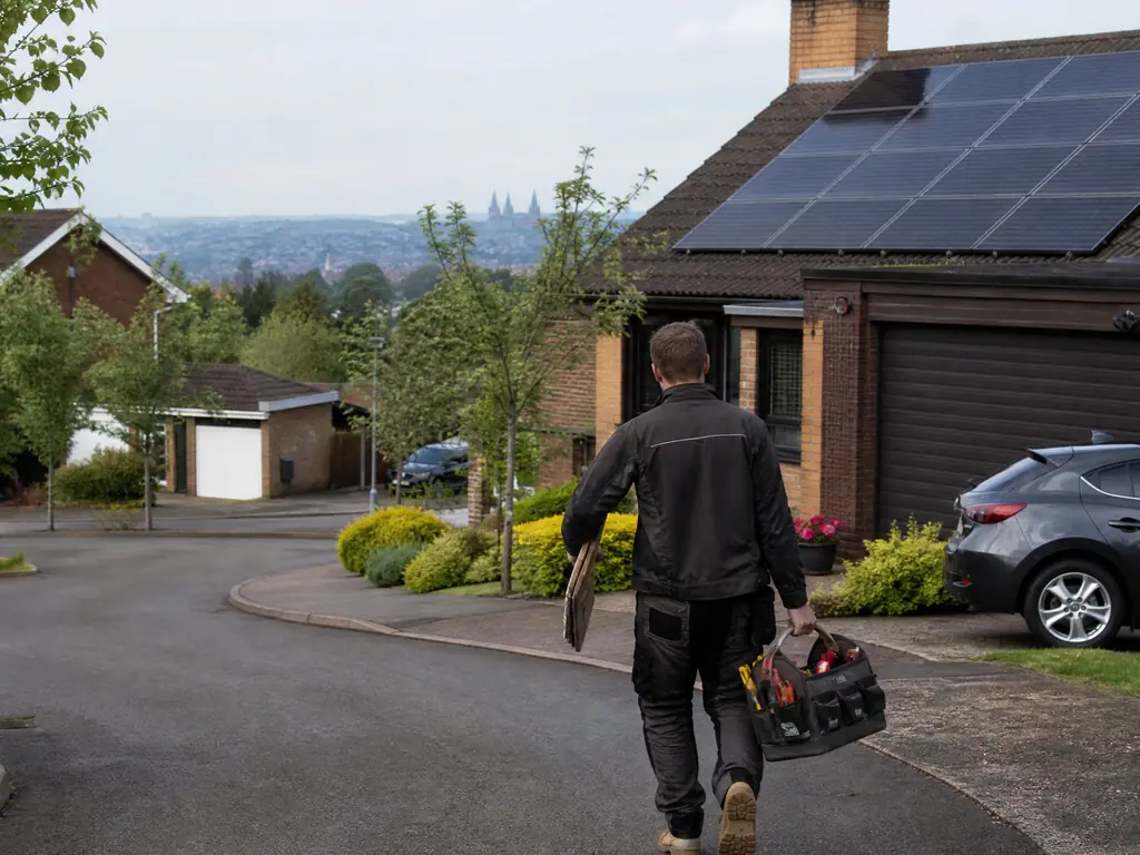 Solar panels on a modern estate house in Lichfield, with the cathedral spires in the distance